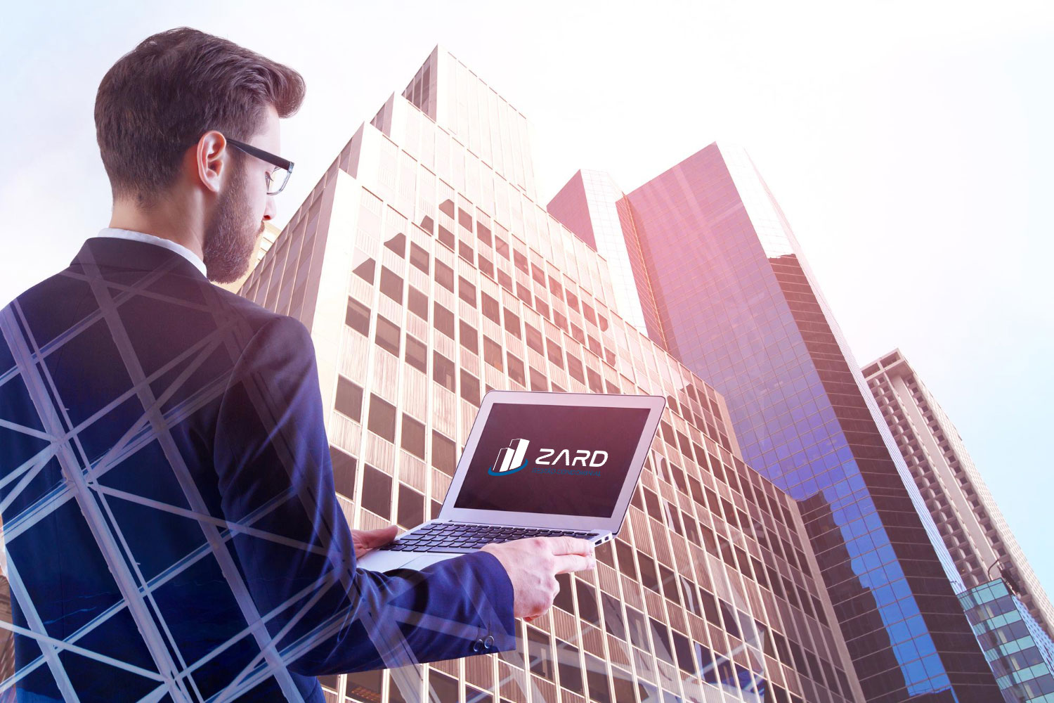 man-using-laptop-city-zard